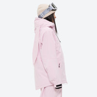 
                  
                    Women's quilted lining ski jacket with suspender bibs - light pink jacket, on-model side view, for cold-weather winter sports
                  
                