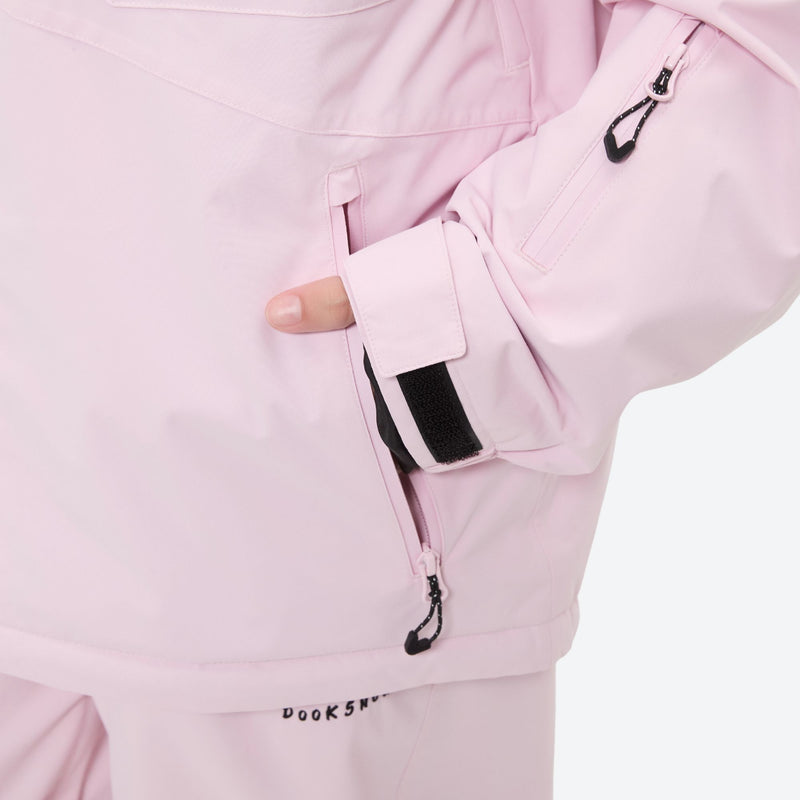 Women's 2-layer snowboard jacket and bibs - light pink, side pocket close-up with hand, for resort and street wear