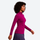 Women's soft merino wool baselayer with half-zip collar - magenta merino wool half-zip top on women, side walking view