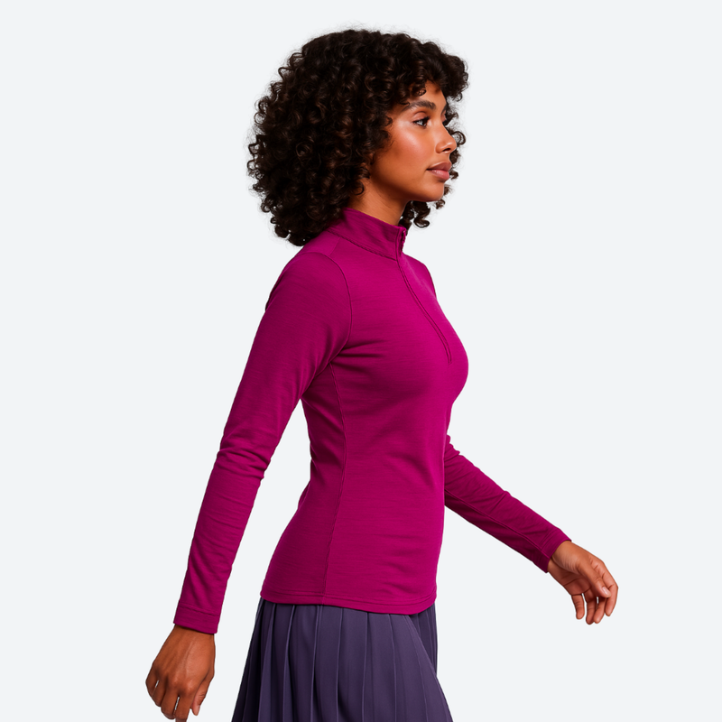 Women's soft merino wool baselayer with half-zip collar - magenta merino wool half-zip top on women, side walking view