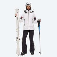 
                  
                    Women's 3-layer snowboard jacket and bib pants - white jacket with black pants, for resort and backcountry days
                  
                