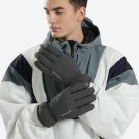 
                  
                    Insulated winter sports gloves with grip palm - gray full-finger snow gloves on men in white gray jacket, front standing view
                  
                