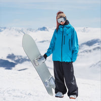 
                  
                    Women's waterproof 3L insulated snow jacket - blue insulated jacket with gray pants, for cold-weather winter sports
                  
                