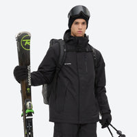 
                  
                    Unisex snowboard jacket and bibs set - black, front with upright skis and poles, for cold-weather winter sports
                  
                