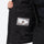 Breathable 2-layer ski jacket with suspender bibs - black, interior label close-up detail, high storm collar blocks wind
