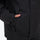 Breathable 2-layer ski jacket with suspender bibs - black, side pocket close-up with hand, for cold-weather winter sports