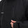 Unisex waterproof 2L snow jacket and bib pants series - black, chest zip close-up with hand, for powder and piste riding