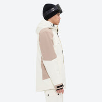 
                  
                    Unisex snowboard jacket and bibs set - white and tan colorblock, on-model side view, for resort and backcountry days
                  
                