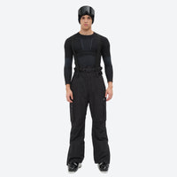 
                  
                    Unisex snowboard jacket and bibs set - black bib pants, on-model front view, for powder and piste riding
                  
                