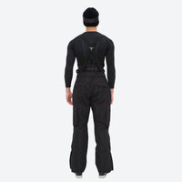 
                  
                    Unisex snowboard jacket and bibs set - black bib pants, on-model back view, for resort and backcountry days
                  
                