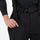 Unisex snowboard jacket and bibs set - black bib pants, bib waist strap close-up with hand, for cold-weather winter sports