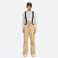 
                  
                    Unisex waterproof 2L snow jacket and bib pants series - tan bib pants, on-model front view, for resort and backcountry days
                  
                