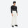 Unisex snowboard jacket and bibs set - white snow pants, on-model three-quarter front view, for skiing and snowboarding