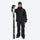 Breathable 2-layer ski jacket with suspender bibs - black, front with upright skis and poles, high storm collar blocks wind