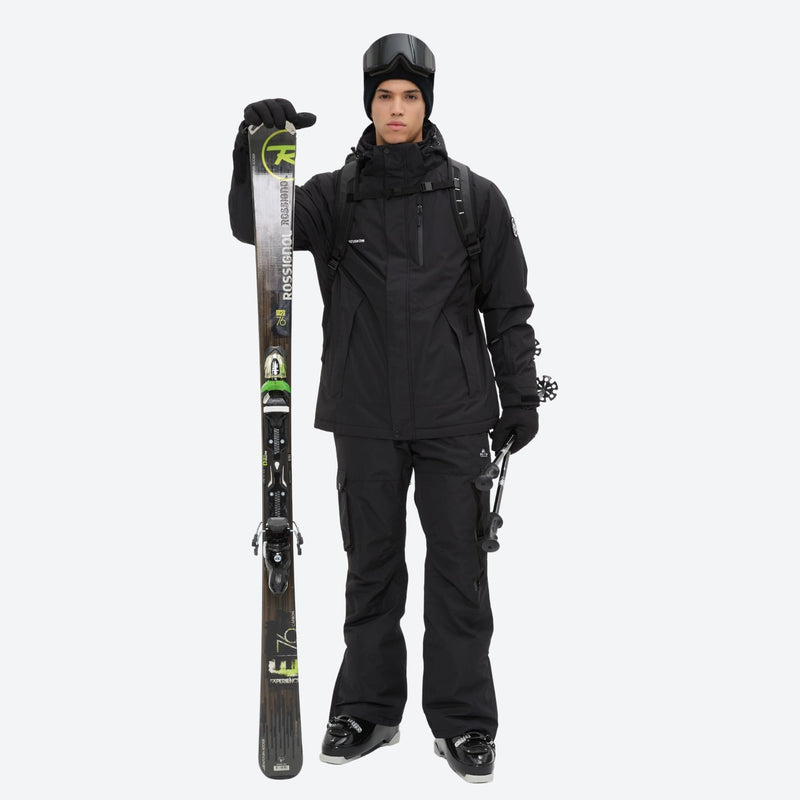 Breathable 2-layer ski jacket with suspender bibs - black, front with upright skis and poles, high storm collar blocks wind
