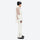 Breathable 2-layer ski jacket with suspender bibs - white and tan colorblock jacket with white pants, on-model side view