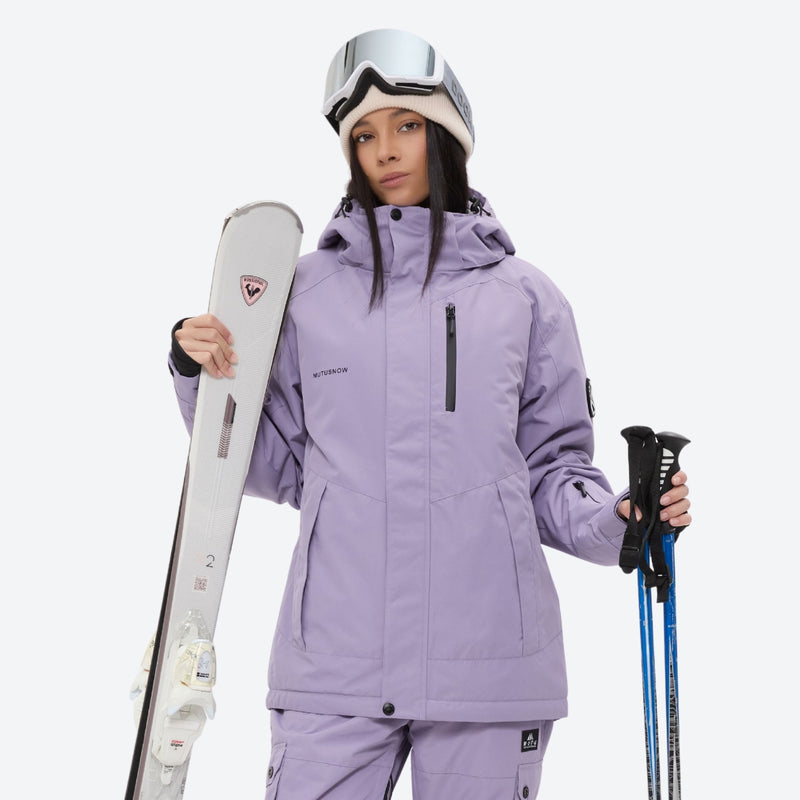 Women's 2-layer snowboard jacket and bibs set - lavender, front with upright skis and poles, for cold-weather winter sports