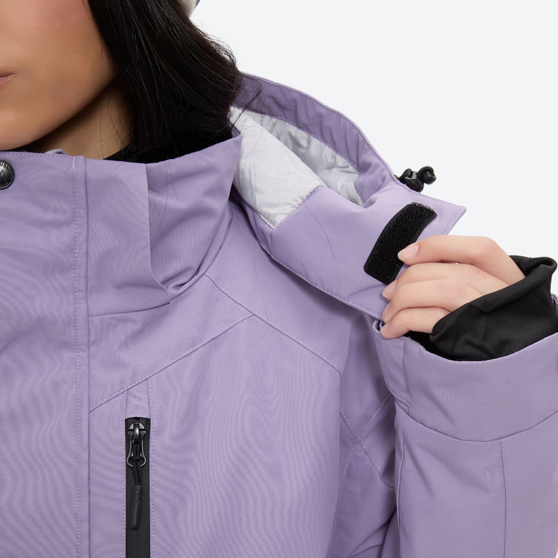 Women's 2-layer snowboard jacket and bibs set - lavender, collar close-up with hand, for snowy mountain travel