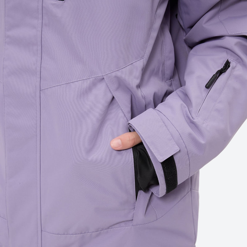 Women's breathable ski jacket with suspender pants - lavender, side pocket close-up with hand, for skiing and snowboarding