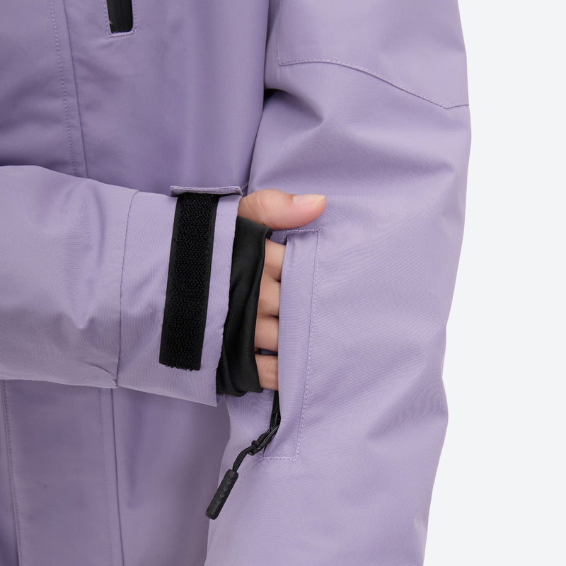 Women's 2-layer snowboard jacket and bibs set - lavender, cuff strap close-up with hand, for skiing and snowboarding