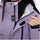 Women's waterproof 2L ski jacket and bib pants - lavender, chest zip close-up with hand, 2-layer waterproof breathable shell