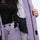 Women's breathable ski jacket with suspender pants - lavender, interior lining close-up with hand, for snowy mountain travel