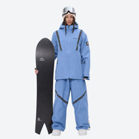 
                  
                    Waterproof snow jacket and pants set - blue, on-model front with upright snowboard, for resort and backcountry days
                  
                