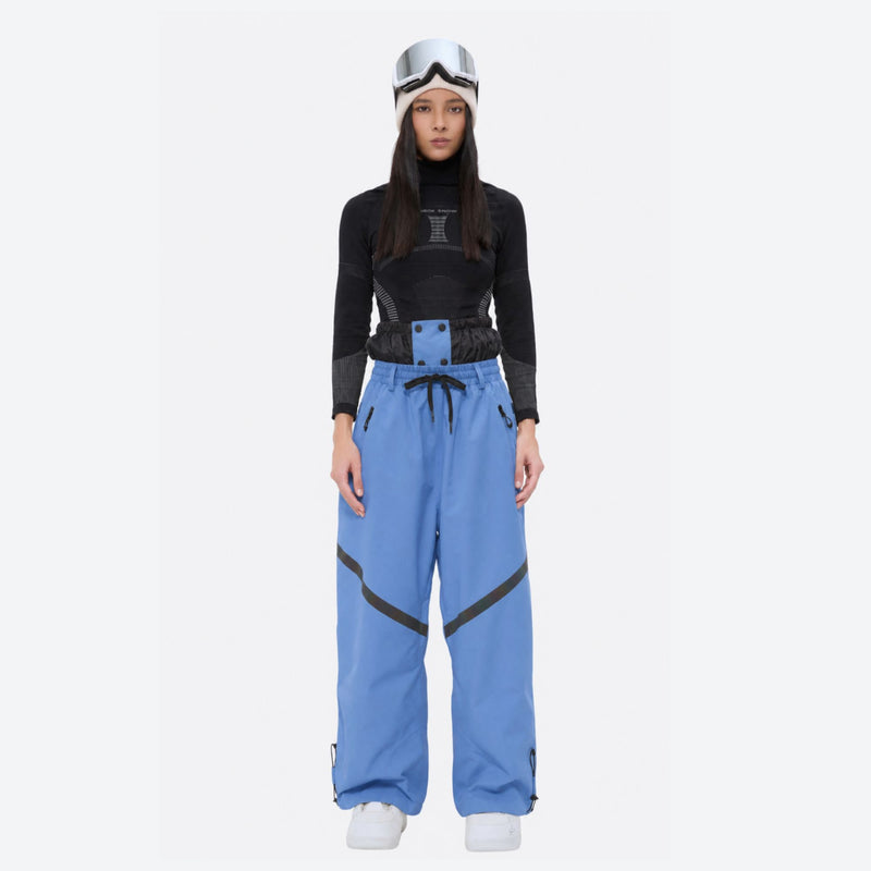 Waterproof snow jacket and pants set - blue, on-model front holding snowboard, for powder and piste riding