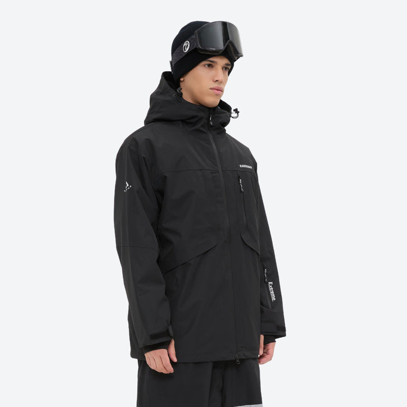 Unisex snowboard bib pants - black jacket with black bib pants, on-model side view, for skiing and snowboarding
