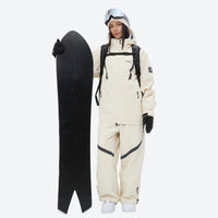 
                  
                    Breathable ski jacket and snow pants combo - cream, on-model front holding snowboard, for resort and backcountry days
                  
                
