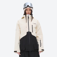 
                  
                    Waterproof snow jacket and pants set - cream and black colorblock, on-model front view, for powder and piste riding
                  
                