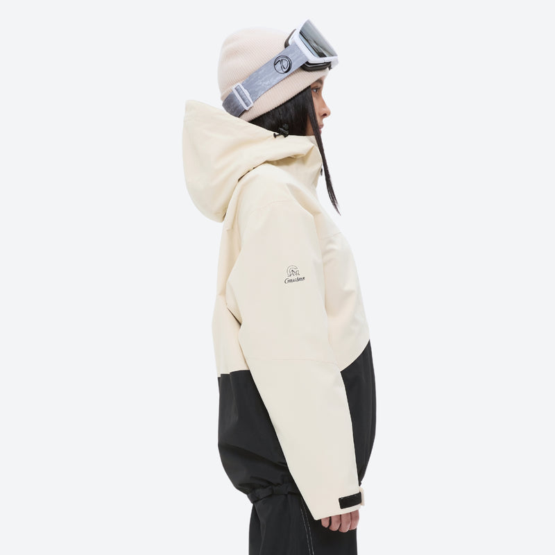Waterproof snow jacket and pants set - cream and black colorblock, on-model hood side view, for resort and backcountry days