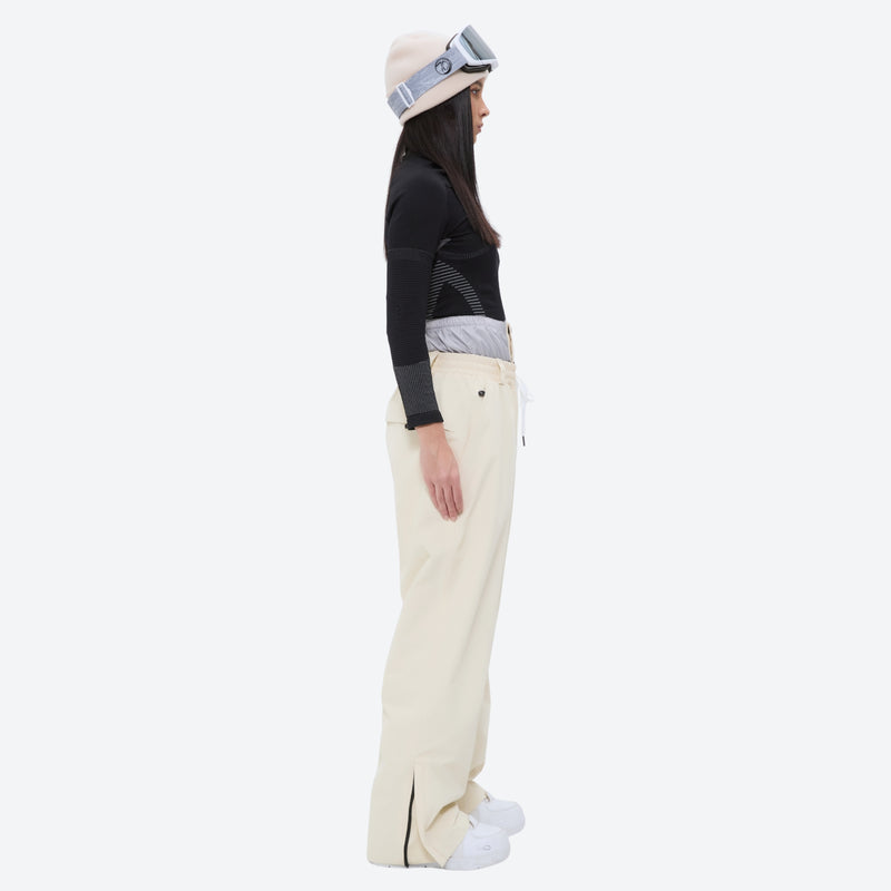 Breathable ski jacket and snow pants combo - women's cream pants with black base layer, for powder and piste riding