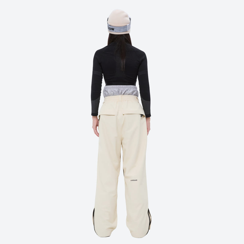 Waterproof snow jacket and pants set - women's cream pants with black base layer, for resort and backcountry days