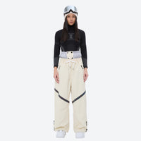 
                  
                    Women's breathable ski jacket with iridescent straps - cream snow pants with black top, for powder days and winter commute
                  
                