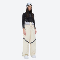 
                  
                    Women's snowboard jacket and wide-leg pants - cream snow pants with black top, for cold-weather winter sports
                  
                