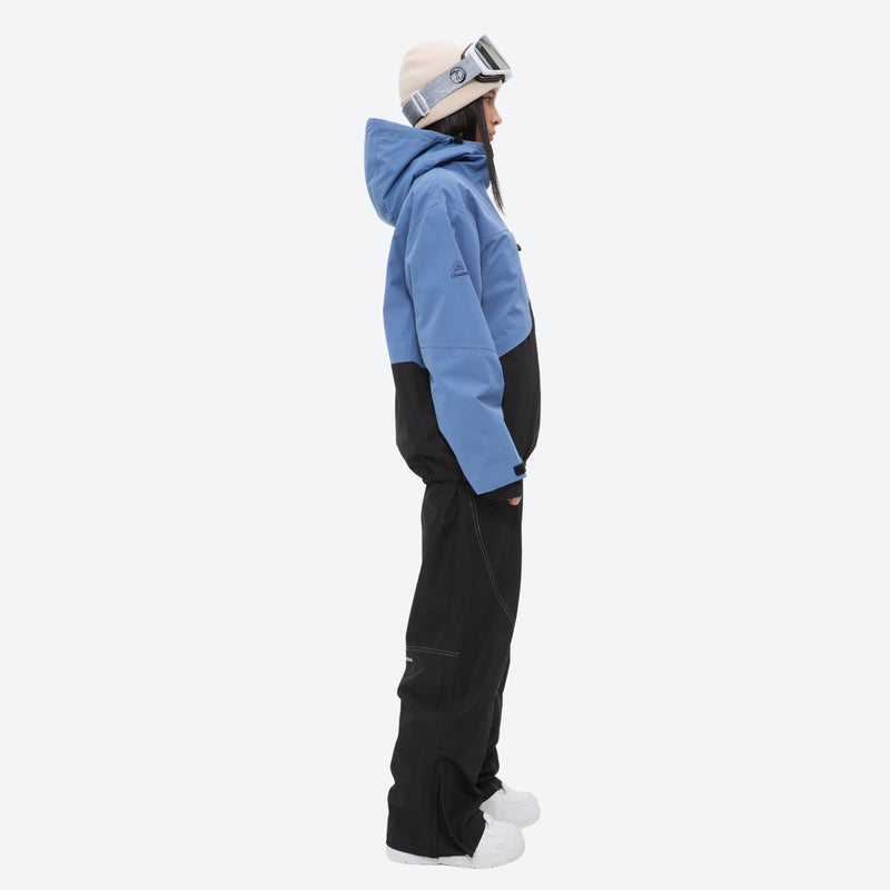 Waterproof snow jacket and pants set - blue and black colorblock, on-model side view, for resort and backcountry days