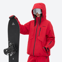 
                  
                    Breathable ski jacket and snow pants combo - red, on-model front holding snowboard horizontal, for skiing and snowboarding
                  
                