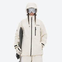 
                  
                    Breathable ski jacket and snow pants combo - women's cream, on-model front holding snowboard, for skiing and snowboarding
                  
                