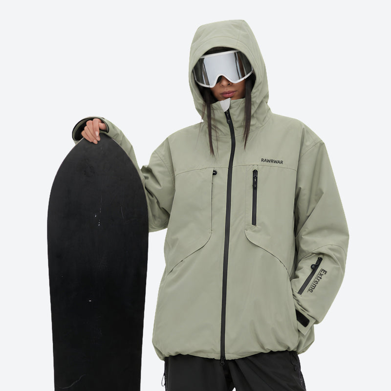 Waterproof snow jacket and pants set - sage green, on-model front with upright snowboard, for skiing and snowboarding