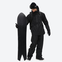 
                  
                    Men's waterproof 2L snow jacket and pants set - black, on-model front with upright snowboard, for resort and backcountry days
                  
                