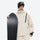 Men's waterproof 2L snow jacket and pants set - cream, on-model front with upright snowboard, for cold-weather winter sports