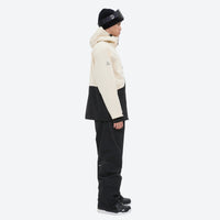 
                  
                    Waterproof 2L snow jacket and pants set - cream and black colorblock, on-model side view, for skiing and snowboarding
                  
                