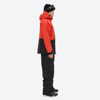 
                  
                    Breathable 2L snowboard jacket and pants - orange-red and black colorblock, on-model side view, for skiing and snowboarding
                  
                