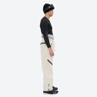 
                  
                    Men's colorblock snowboard jacket and pants - cream pants, on-model side view, for resort and backcountry days
                  
                