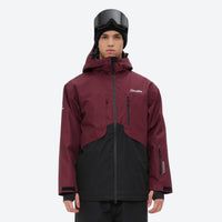 
                  
                    Breathable 2L snowboard jacket and pants - wine and black colorblock, on-model front view, for cold-weather winter sports
                  
                