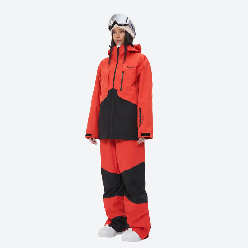 Waterproof snow jacket and pants set - orange and black colorblock, on-model front view, for resort and backcountry days