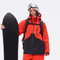 
                  
                    Waterproof snow jacket and pants set - orange and black colorblock, for cold-weather winter sports
                  
                