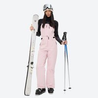 
                  
                    Unisex snowboard bib pants with snow gaiters - pink bib pants with black top, for powder and piste riding
                  
                