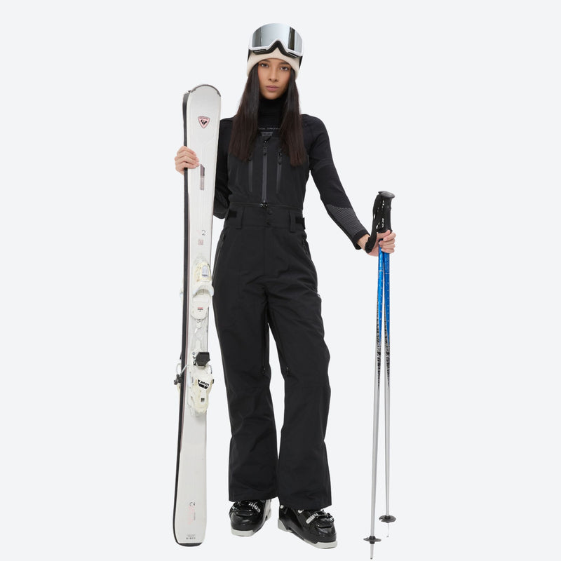 Unisex snowboard bib pants with snow gaiters - black bib pants with black top, for cold-weather winter sports